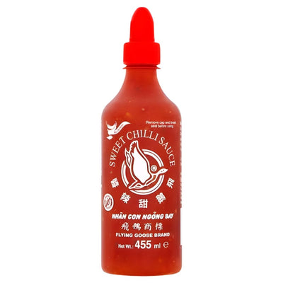 Flying Goose - Sweet Chilli Sauce - 455ml: Add authentic Thai flavour to your dishes with this classic sauce from Flying Goose. Comes in a 455ml bottle with a red cap, featuring the signature logo and white text on the label.
