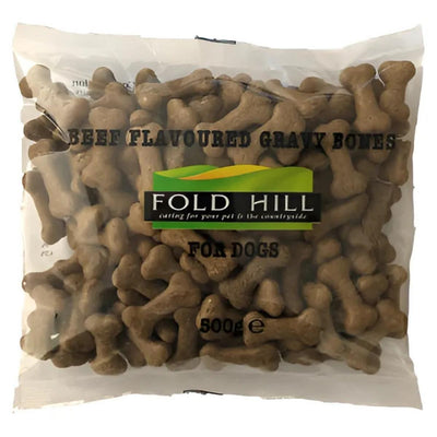Fold Hill Beef Flavoured Gravy Bones, 500g, provides a nutritious dog treat in the shape of bones, viewable through transparent packaging.