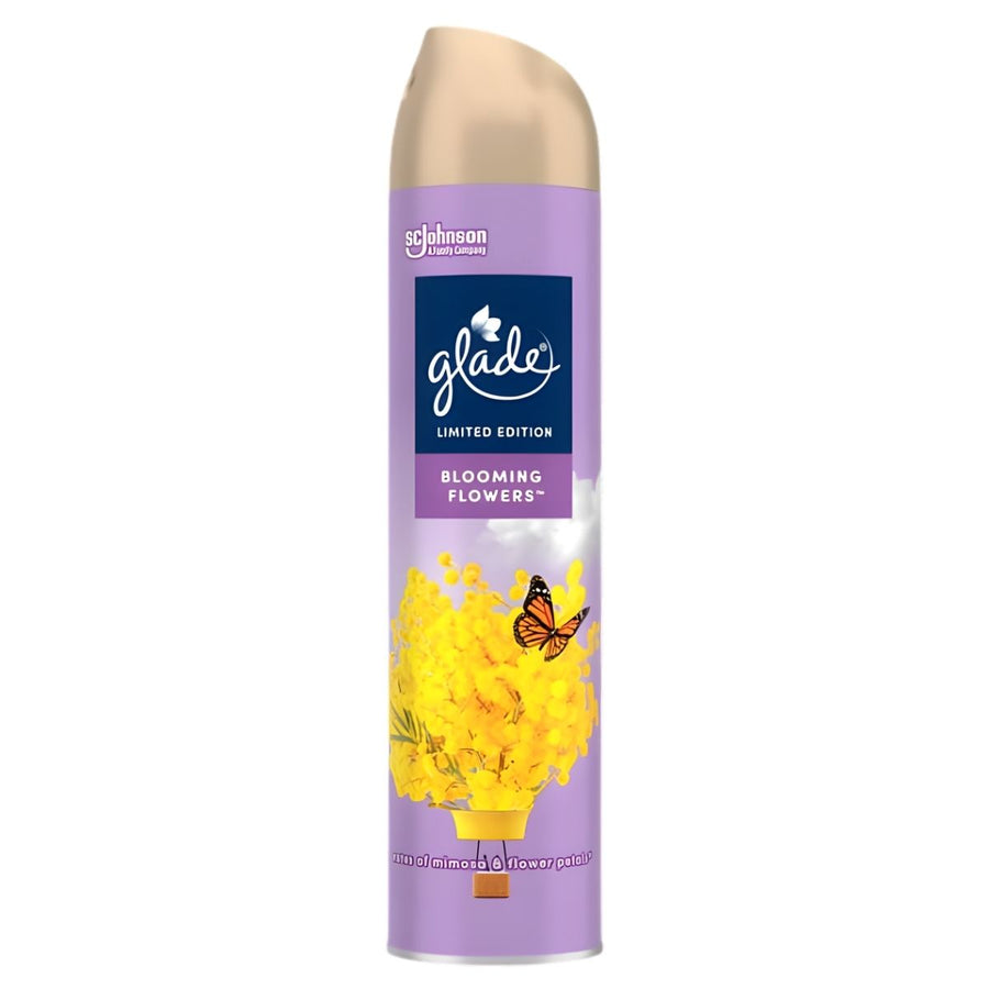 A 300ml can of Glade Blooming Flowers Air Freshener Spray features a floral scent with yellow flowers and a butterfly on a purple background.