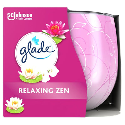 Glade - Relaxing Gen Scented Candle - 120g features a pink package with white and pink lotus flowers, Glade branding, and draws inspiration from the calming ambiance of a relaxing scented candle.