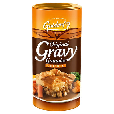 A 300g cylindrical container of Goldenfry Gravy Chicken Granules, with a label showing a chicken pie and vegetables topped with savory chicken flavor gravy.