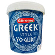 A tub of Göreme Greek Style 10% vol yogurt, featuring a blue label with white Greek key patterns and a white lid, isolated on a white background.