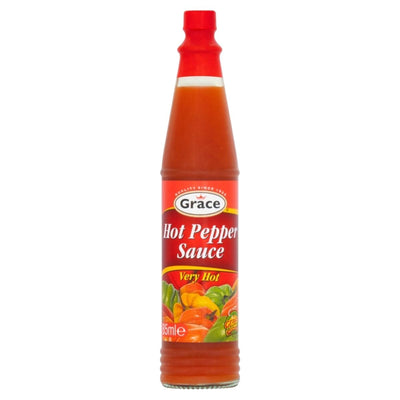 Bottle of Grace hot pepper sauce on a white background