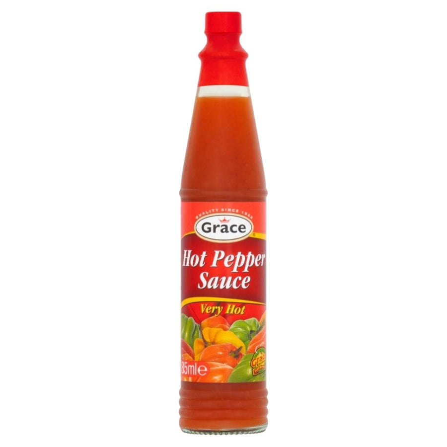 Bottle of Grace hot pepper sauce on a white background