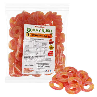 A clear 1Kg pack of Gummy Rush - Atomic Peaches (Halal) peach gummies featuring a front label, with several gummy rings shown beside the package.