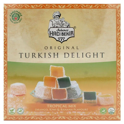 Experience the luxury of the Ottoman Palace with Haci Bekir's Tropical Mix Turkish Delight, featuring a delightful assortment of mango, kiwi, and banana flavors, beautifully presented on a decorative plate.