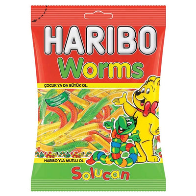 The Haribo - Worms - 80g pack features colorful worms on the packaging and cartoon characters, with Turkish text reading "solucan" and "çocuk ya da büyük ol.