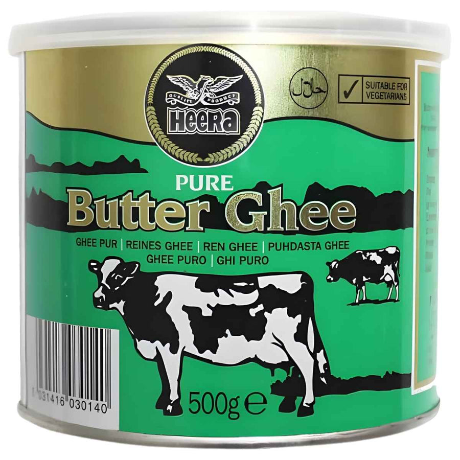 Heera - Pure Butter Ghee - 500g tin features green and gold labeling with cow illustrations and is suitable for vegetarians.