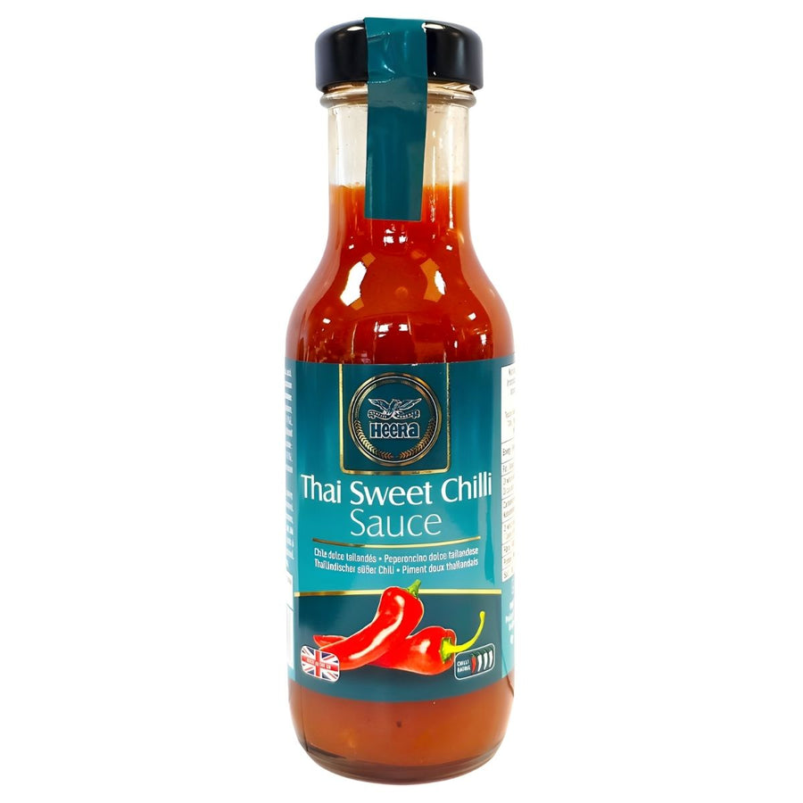 Heera Thai Sweet Chilli Sauce (250ml) comes in a glass bottle with a blue label, featuring red chilies and product details—ideal for anyone who loves a delicious blend of sweet and spicy flavors.