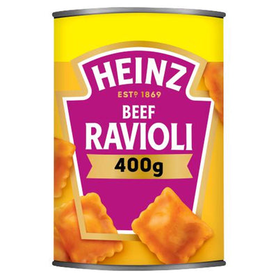 A 400-gram can of Heinz Beef Ravioli in Tomato Sauce, with a yellow and magenta label featuring images of ravioli.