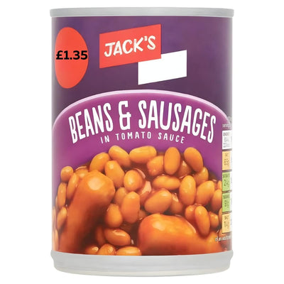 A 395g can of Jacks Beans & Sausages in Tomato Sauce, classic comfort food, with nutritional info on the side and priced at £1.35 on the lid.