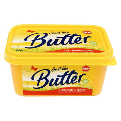 A yellow tub labeled "Just Like Butter - A Rich Buttery Spread - 500g" with a red butterfly and grass design, indicating it's a rich buttery spread. Suitable for vegetarians and gluten free, this spread also contains no artificial colors.