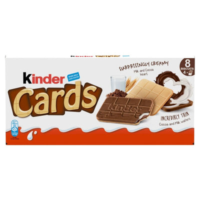 Kinder Cards Biscuit Wafers by Kinder feature 8 individually wrapped, thin vanilla and chocolate wafer biscuits with creamy cocoa filling in a 102.4g box, shown with a glass of milk and cocoa powder on the packaging.