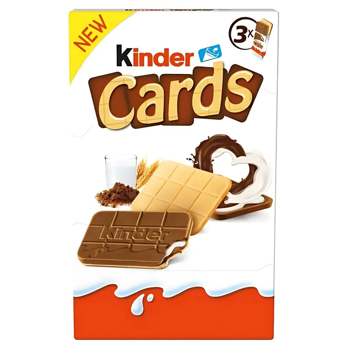 Kinder - Cards Cocoa and Milk Biscuit Wafers Multipack, featuring a chocolate and cream wafer with a bite taken out, displayed beside a splash of milk and cocoa. The packaging includes a "new" label and "3x" in the corner.