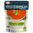 A 250ml pouch of Legurme Tomato Soup, with a bowl of creamy soup shown on the packaging. The label highlights plant-based ingredients, tomato puree, and key nutrition facts.
