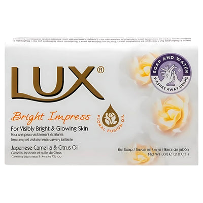 Front view of Lux - Bright Impress Soap - 80g box, with Japanese Camellia and Citrus Oil. Features floral graphics and bilingual (English/French) product details for a radiant complexion.
