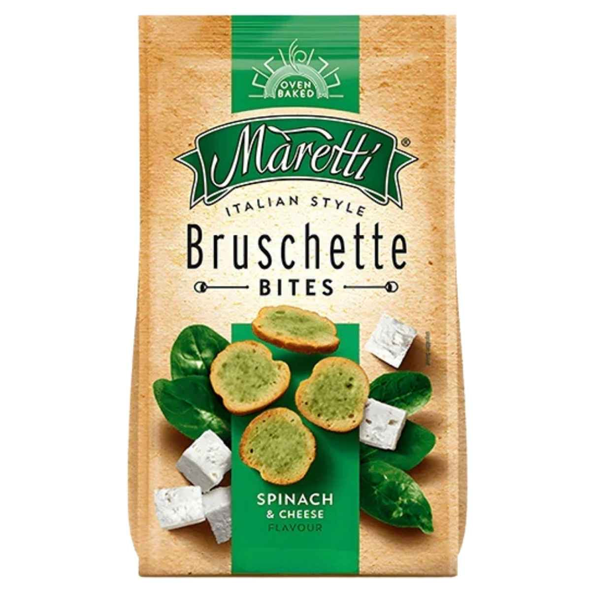 A 70g bag of Maretti Bruschette Spinach & Cheese Flavour shows the baked snacks, fresh spinach leaves, and cheese cubes on the packaging.