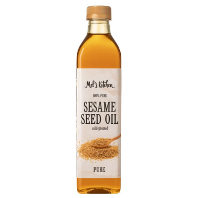 A clear glass 500ml bottle of Mel's Kitchen 100% Pure Sesame Seed Oil with a tan cap and a label featuring sesame seeds and a spoon, highlighting its antioxidant-rich pure sesame oil.