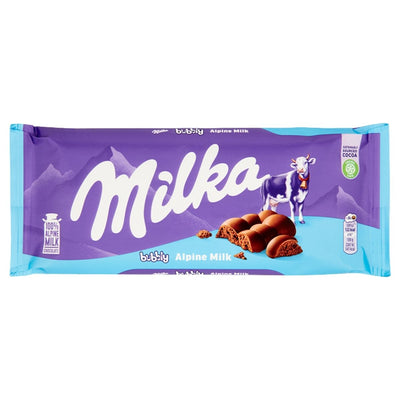 Milka Bubbly Alpine Milk Chocolate Bar (90g) features the signature Milka branding with purple and blue packaging displaying a cow and airy milk chocolate pieces.