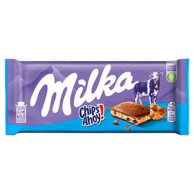 The Milka - Chips Ahoy! Chocolate Bar (100g) combines Alpine milk chocolate with crunchy cookie pieces, packaged in Milka’s signature purple wrapper featuring a cow illustration and branding.