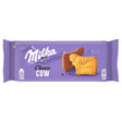 The Milka Choco Cow Biscuit 120g pack features cow-shaped biscuits partly covered in Alpine milk chocolate, set against a purple background that showcases the Milka brand’s European chocolate biscuit heritage.