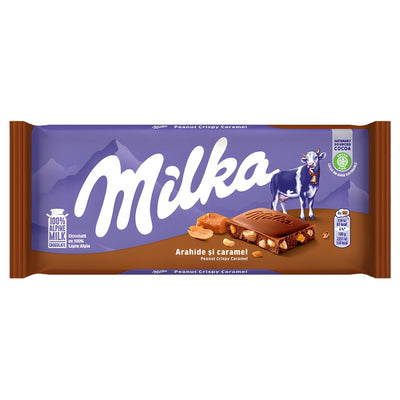 Milka Chocolate With Peanut & Crispy Caramel (90g) combines smooth Alpine milk chocolate with peanuts and crispy caramel. The purple Milka wrapper shows the chocolate bar and features a charming cow illustration.