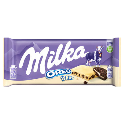 The Milka - Oreo White Chocolate Bar - 100g features Milka's signature purple packaging, a cow illustration, and images of creamy white chocolate filled with crunchy Oreo cookie pieces.