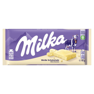 Milka White Chocolate Bar, 90g, made with creamy Alpine milk and sustainable cocoa. The purple and cream wrapper shows a cow, mountains, and features "Weiße Schokolade" plus "100% Alpenmilch" text. Brand: Milka.