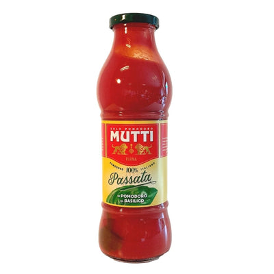 A 700g glass bottle of Mutti Tomato Puree With Basil, featuring a red and yellow label and green twist-off cap for authentic Italian flavor.