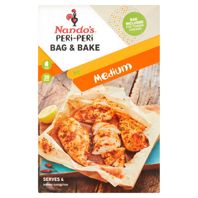 Nando’s Peri-Peri Bag & Bake Medium 20g features African bird’s eye chilli spice and includes a bag for easy parchment cooking; packaging serves 4, with cooked chicken pieces shown on parchment paper.