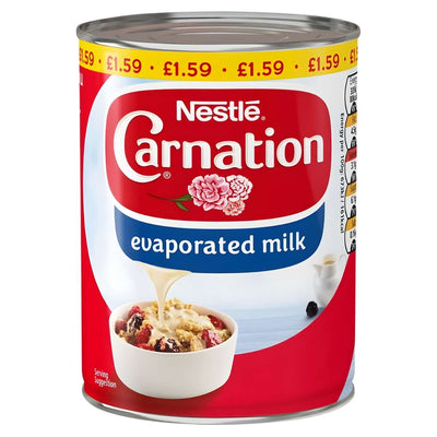 A 410g can of Nestle Carnation Evaporated Milk, enriched with vitamin D, features an image of milk poured over cereal and berries. The top edge displays the price: £1.59.