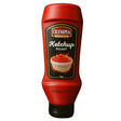Red bottle of Olympia Picant ketchup on a white background