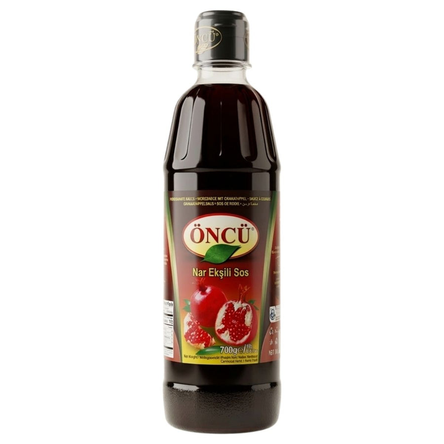 Bottle of Oncü pomegranate syrup on a white background