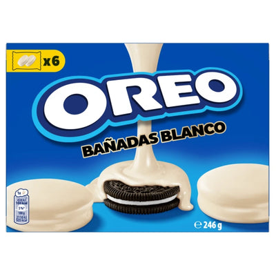 Oreo - Banadas Covered Chocolate White sandwich cookies, with one cookie drizzled in white chocolate, displayed on a blue box.