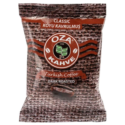 A 100g package of Oza Classic Dark Roasted Turkish Coffee features a brown woven texture background with white and red text on the front.