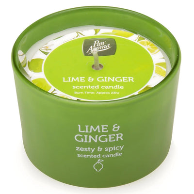 The Pan Aroma "Lime & Ginger" scented candle, in a green container adorned with lime illustrations, offers relaxation with its refreshing aroma and approximately 23 hours of burn time.