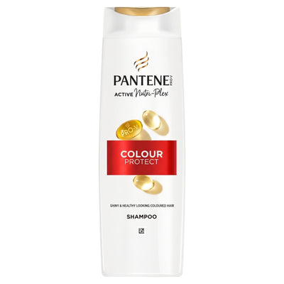 A white bottle of Pantene Colour Protect Shampoo with a gold cap, featuring Pantene branding and gold hair capsules on a white background.