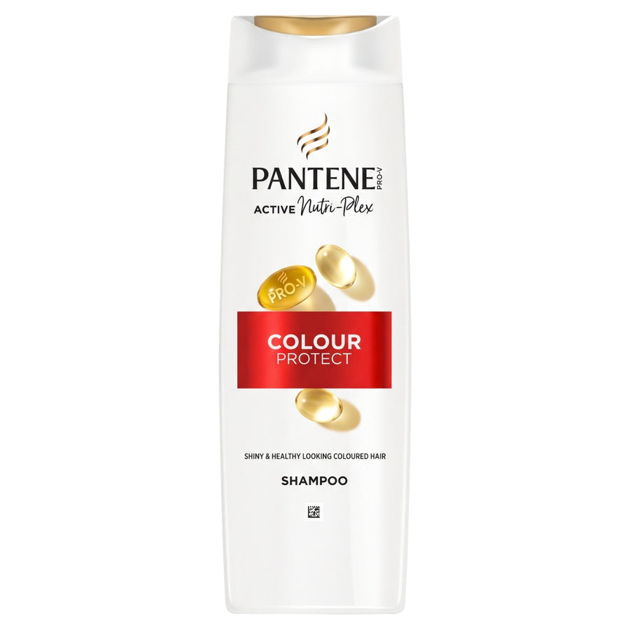 A white bottle of Pantene Colour Protect Shampoo with a gold cap, featuring Pantene branding and gold hair capsules on a white background.