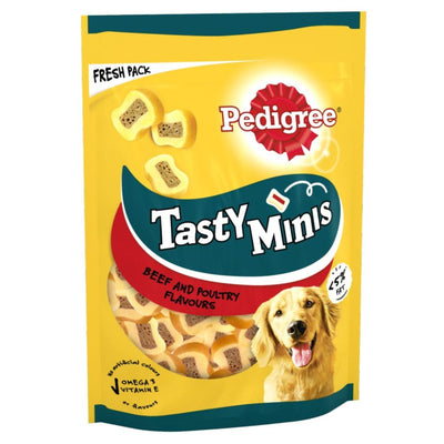 A yellow 155g packet of Pedigree Tasty Minis Adult Dog Treats Beef & Poultry Chewy Slices, featuring a golden retriever and bone-shaped treats.