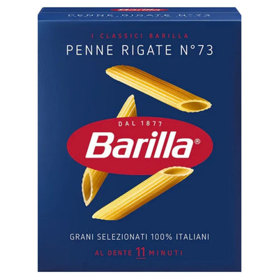 The Barilla Penne Rigate Pasta n.73, in a 500g blue box with penne images and a red logo, is made from 100% Italian durum wheat semolina for optimal flavor and notes an 11-minute cooking time.