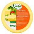 A round package of PİNİR Taze Kaşır cheese, showing the front label with product details, a photo of cheese wedges with herbs and a tomato, and an orange background on a white studio backdrop.
