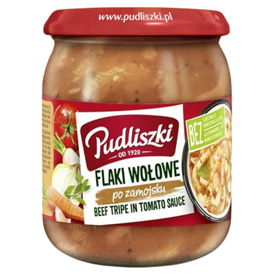 Jar of Pudliszki beef tripe in tomato sauce with a red lid on a white background