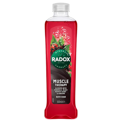 A 500ml bottle of Radox Muscle Therapy Bath Soak, with a red liquid, features minerals, the scent of black pepper, ginseng extract, and is designed to help relax muscles.