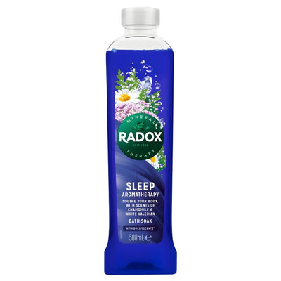 A 500ml bottle of Radox Sleep Aromatherapy Bath Soak by Radox, featuring a calming formula with chamomile and white valerian, blue liquid, and floral graphics on the label.