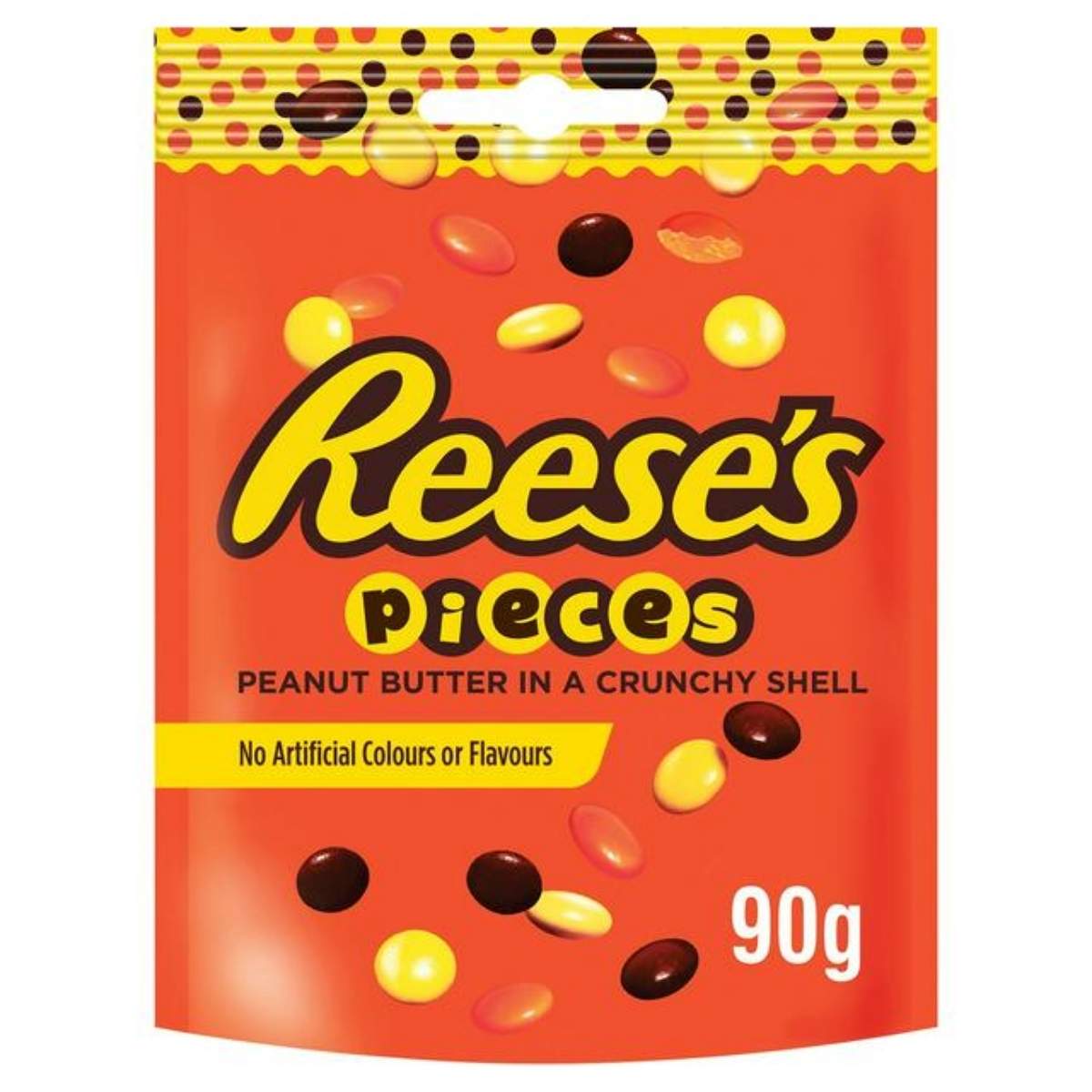 A 90g pouch of Reese's Pieces Peanut Butter in a Crunchy Shell, with vibrant candy-coated peanut butter pieces and labeled as containing "No Artificial Colours or Flavours.