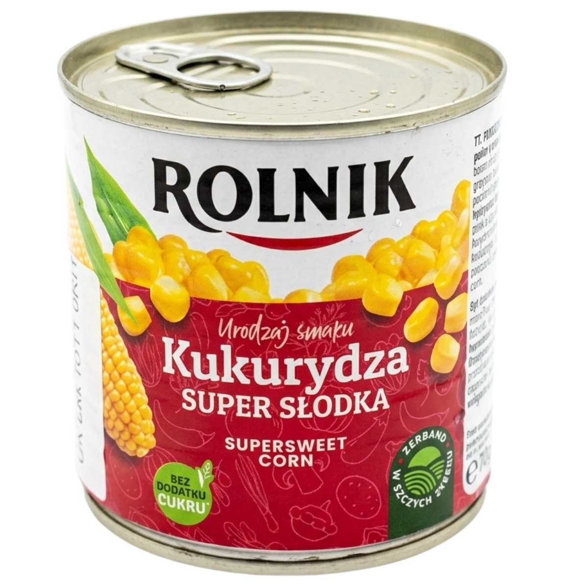 A 340g can of Rolnik Sweet Corn featuring corn kernel and cob images on a mainly red label with white and yellow Polish text.