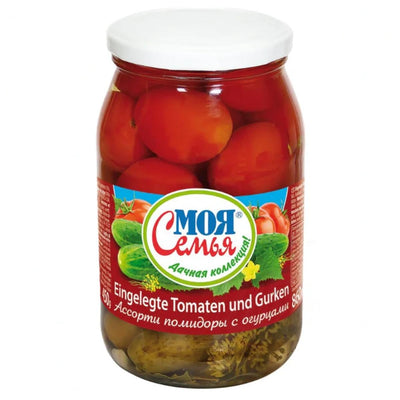 A jar of My Family (Moja Semja) - Tomato & Cucumber - 860g, with a Russian label, displays vibrant red tomatoes and green cucumbers. This snack is delicious and nutrient-rich, making it perfect for any occasion.