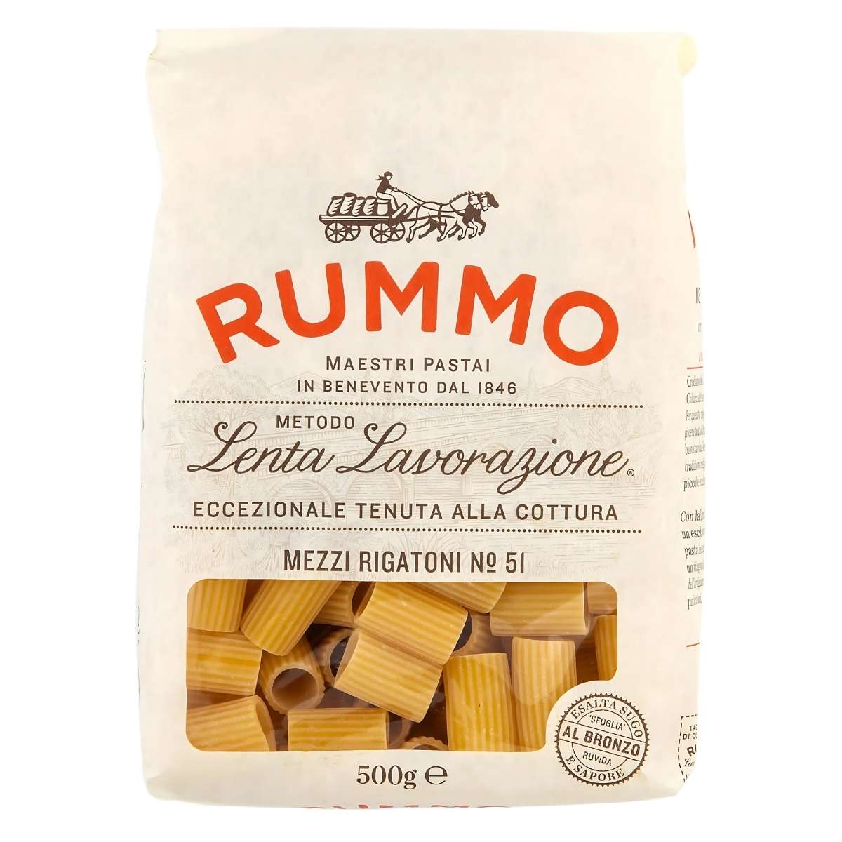 Rummo - Mezzi Rigatoni Pasta No.51, 500g offers an authentic Italian dining experience, emphasizing traditional pasta-making techniques. A transparent window displays the alluring shape of uncooked pasta, ready to be crafted into a delicious meal.