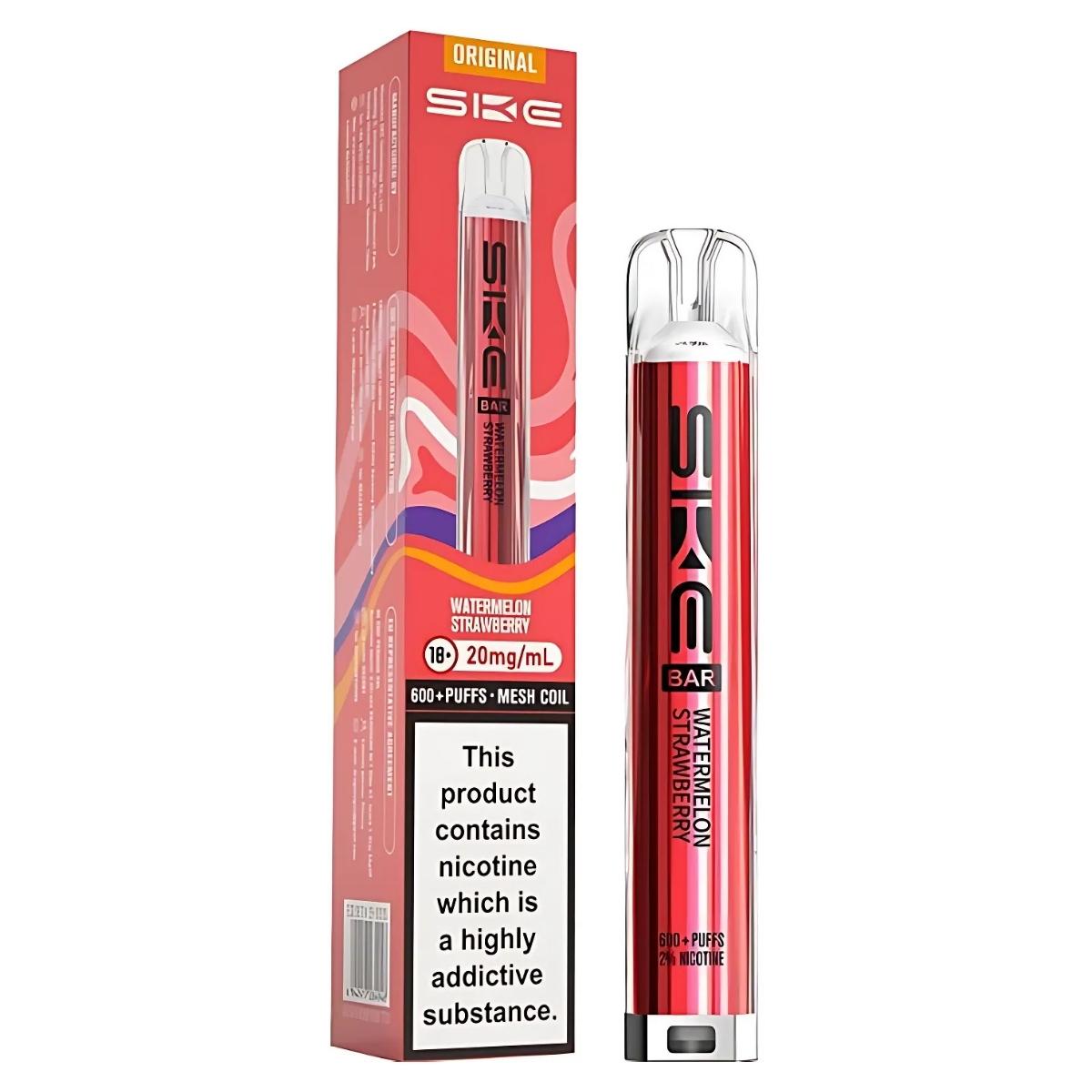 A SKE - Crystal Bar 600 Watermelon Strawberry Pod Vape Kit (20mg/mL) in red stands beside its box, which features product details, a nicotine warning, and promotes convenient USB-C charging.