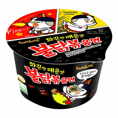 The Samyang - Buldak Hot Chicken Flavour Ramen Bowl (Halal) 105g features the iconic chicken mascot, bold Korean text, and fiery graphics on black packaging, capturing the intense spice of these popular instant noodles.